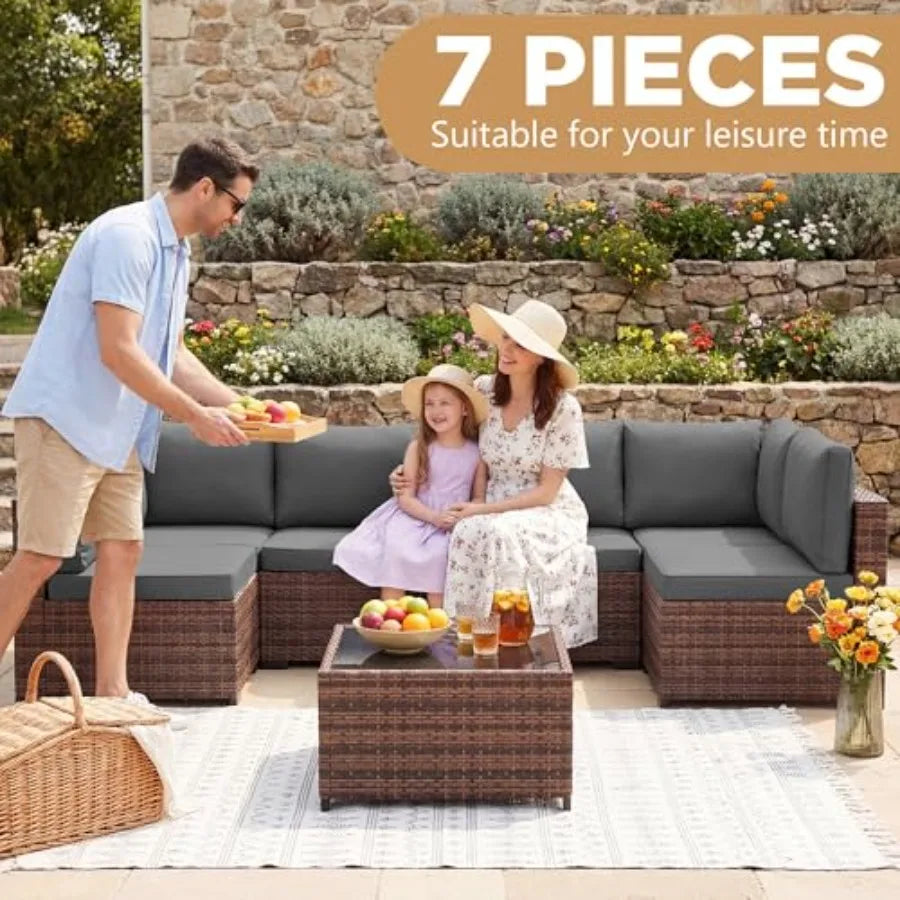 Outdoor patio furniture set: wicker rattan sectional sofa with coffee table and grey cushions, weather-resistant synthetic ratt