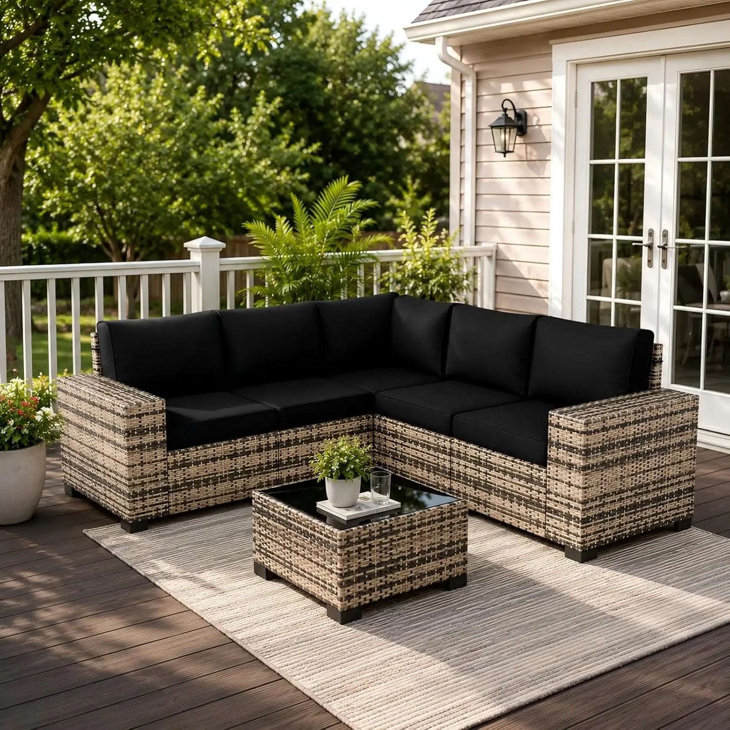 Outdoor Sectional Sofa Featuring Wide Armrests And Wicker Coffee Table