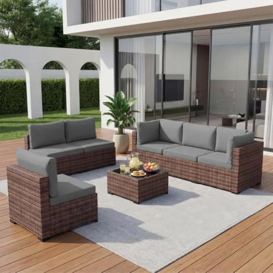 Outdoor patio furniture set: wicker rattan sectional sofa with coffee table and grey cushions, weather-resistant synthetic ratt